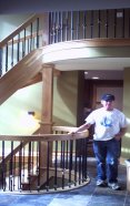  Lynn Seely, standing by upper & Ground Level Stairs withcurved handrailings. 