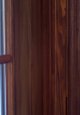 Side oak casing next to wood grained oak door.