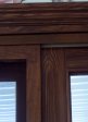 Top oak casing of interior wood grained oak door.