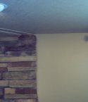 A closeup picture of the stone firewall and custom wall color