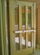 This picture shows a woodgraining undercoat that has been applied to the metal door