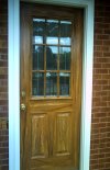 Front view of south entrance woodgrained doorto hair salon