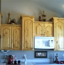View of knotty alderwood kitchen cupboards when the finish yellowed.