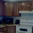 A first undercoat applied to the oak cabinets