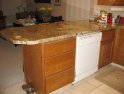 Before picture of  old oak cabinets in eating bar.