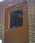A colored undercoat was put on the metal utility door.