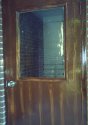 Close of woodgrained metal utility door