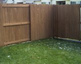 South east corner of a stained apartment fence
