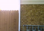 This restained fence has been color matched to the brick
