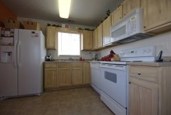  White wood kitchen cabinets  wood grained to match white oak.