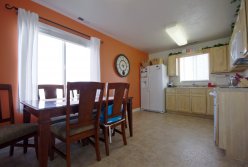  These white wood cabinets were woodgrained toduplicate a magazine picture and color coordinated with the vinyal and countertop
