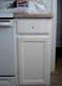 This is a picture of the original white  wood single under the counter kitchen cabinet