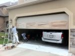 In this picture, an undercoat using light colors to match the home's exterior is being applied
