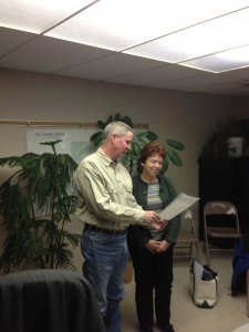New trustee Lucy Meirose being sworn in by Mayor Hershal Deputy