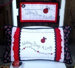 Nothing Bugs a Lady sign and pillow
