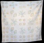 STENCILLED QUILT OF FLORAL BLOCKS